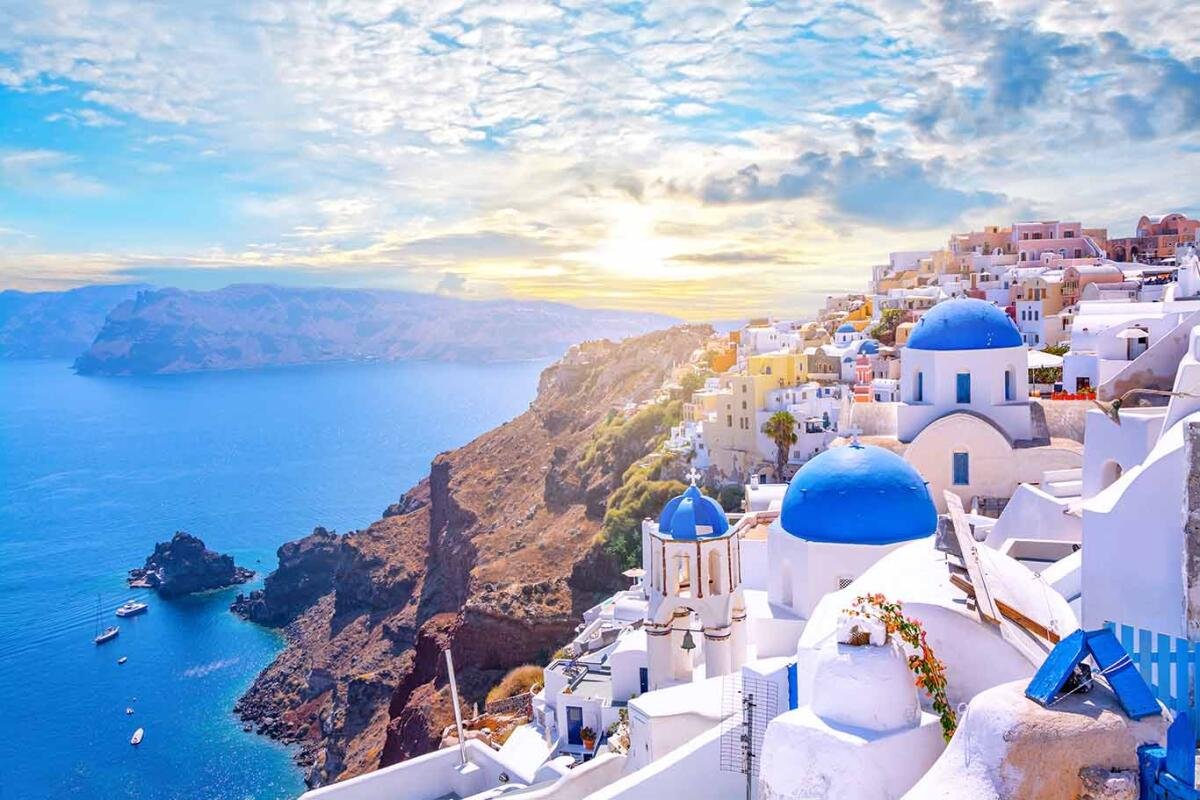 Santorini caldera view with white buildings and blue domes